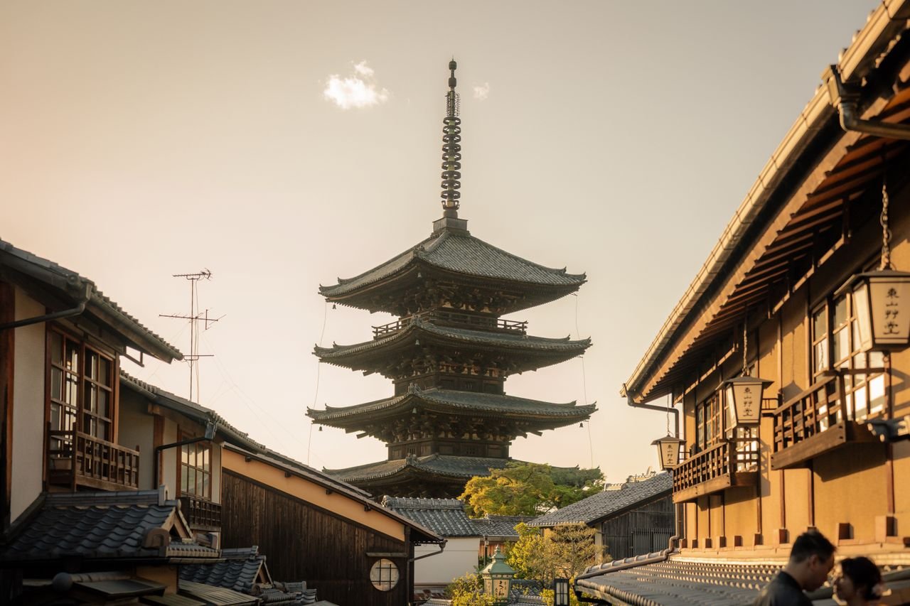 Scenic view of Yasaka Pagoda surrounded by traditional Kyoto architecture at sunset.
